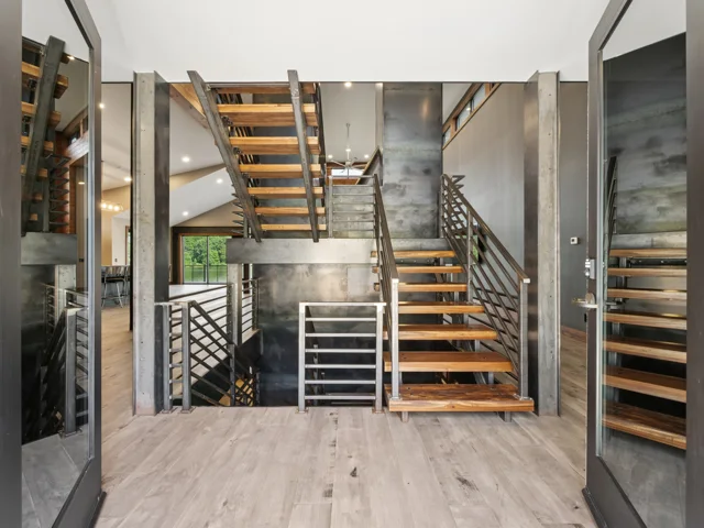 Entry and steel staircase at 88 Lakeview Court