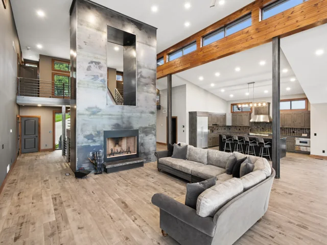 Great room and steel-wrapped fireplace at 88 Lakeview Court