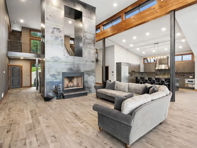 Great room and steel-wrapped fireplace at 88 Lakeview Court