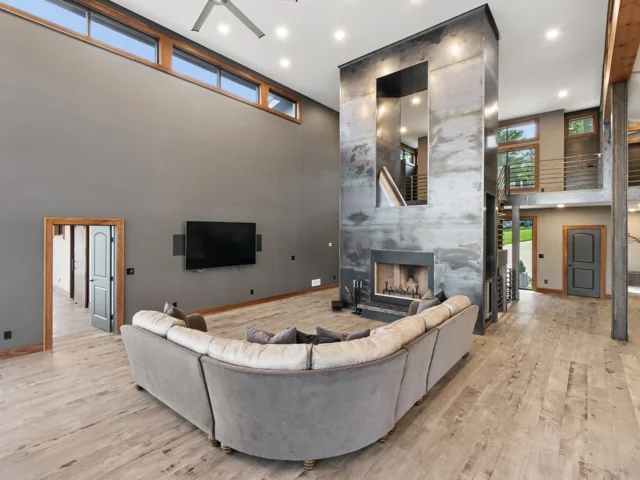 Great room and steel-wrapped fireplace at 88 Lakeview Court