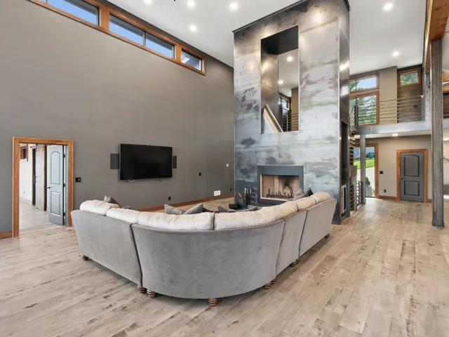 Great room and steel-wrapped fireplace at 88 Lakeview Court