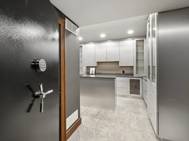 The Collection Room: vault-style door and custom cabinetry at 88 Lakeview Court