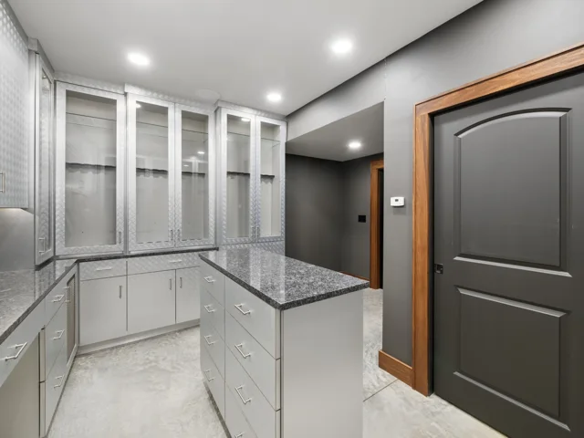 The Collection Room: cabinetry, island and interior entry at 88 Lakeview Court