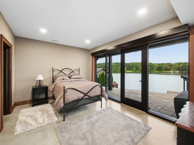Lower-level lake-facing guest bedroom at 88 Lakeview Court