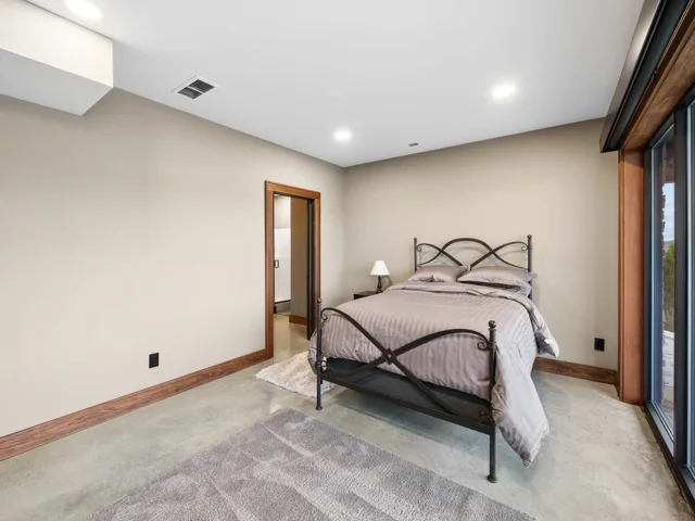 Lower-level lake-facing guest bedroom at 88 Lakeview Court